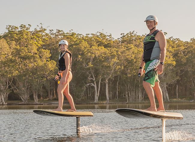 couple riding fliteboards