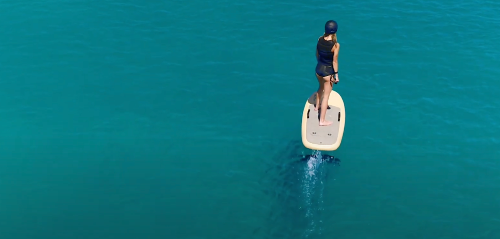 woman riding on efoil board