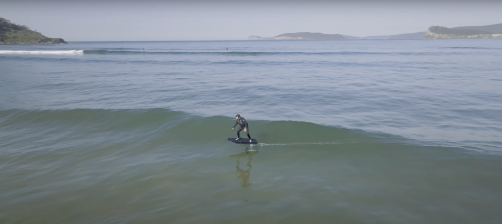 person riding a wetsuit in the cold