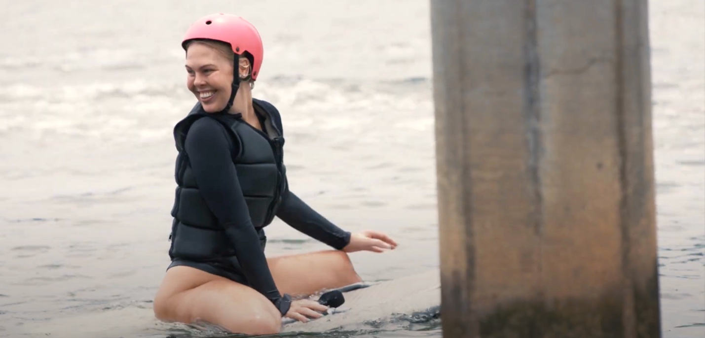 woman on fliteboard with helmet