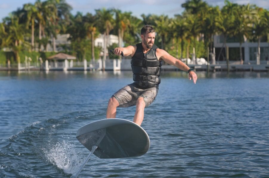 Rider gliding above emerald water on a Fliteboard eFoil near Rosemary Beach, Florida